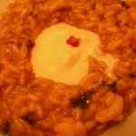 Risotto alla crema di pomodoro con mazzancolle e piccolo calamaro, mantecatura allo squacquarone Risotto alla crema di pomodoro con mazzancolle e piccolo calamaro, mantecatura allo squacquarone